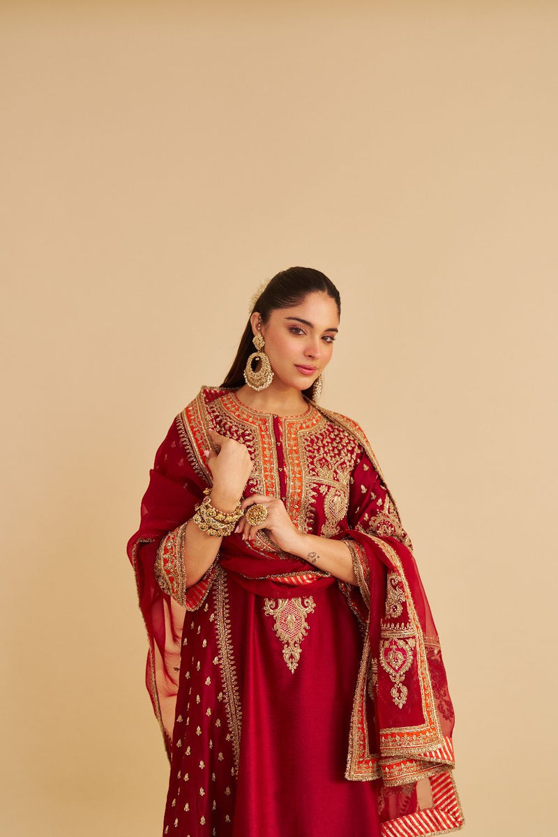 Zoya - Dabka Zardozi Embroidered Rich Banarasi Kalidaar Deep Red Long Chauga Set satin by SHEETAL BATRA in red color for women Worldwide