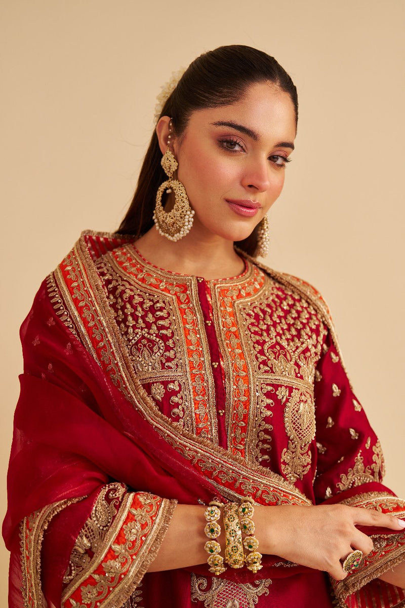 Zoya - Dabka Zardozi Embroidered Rich Banarasi Kalidaar Deep Red Long Chauga Set satin by SHEETAL BATRA in red color for women Worldwide