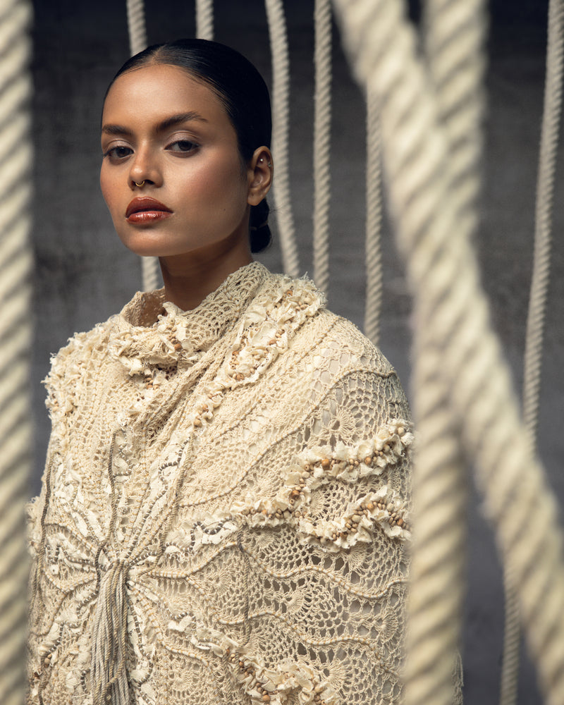 Ivory Crochet Lace Embroidered Cape hand crochet jacket/overlay by Kritika Murarka in ivory for women Worldwide